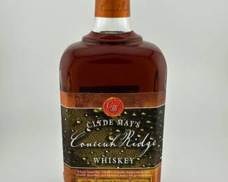 Clyde May’s Conecuh Ridge Small Batch pays tribute to the legacy of Alabama’s legendary moonshiner, Clyde May, with a handcrafted bourbon that blends tradition and innovation. Produced in limited batches, this whiskey highlights a smooth and balanced profile of caramel, vanilla, dried fruit, and gentle spice, reflecting the brand’s signature “Alabama-style” character. With its heritage appeal, small-batch exclusivity, and growing reputation among collectors, Conecuh Ridge Small Batch stands out as both a drinkable classic and a desirable auction offering. Note: Label is damaged in bottom left corner