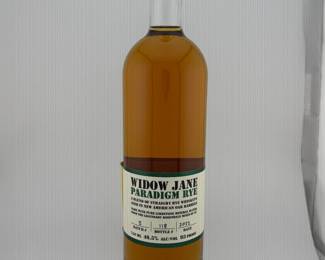 The Widow Jane Paradigm Rye showcases the distillery’s innovative approach to blending, marrying hand-selected ryes from Kentucky, Indiana, and Tennessee before proofing with pure limestone mineral water from New York’s historic Rosendale Mines. This 2022 release, drawn from Batch #5 and individually numbered as Bottle #118, offers a bold yet balanced profile of spice, citrus, and oak, with a smooth finish that reflects Widow Jane’s signature style. With its small-batch production, numbered bottling, and growing recognition in the American rye category, Paradigm Rye has become a standout collectible and a strong feature at auction.