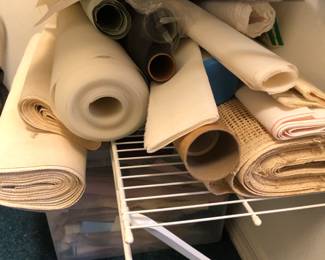 Bolts of cross stitch, needlepoint and rug canvases.