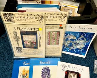 Just a few of the dozens and dozens of needlecraft kits and patterns.  Note The Scarlett Letter kits.  Lots of vintage patterns.  