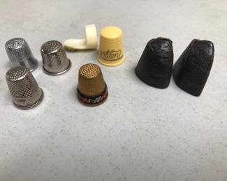 Thimbles.  Including leather and micro petit point.