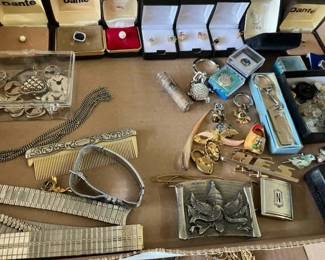 Huge selection of costume jewelry rings, necklaces, lighters, trinkets