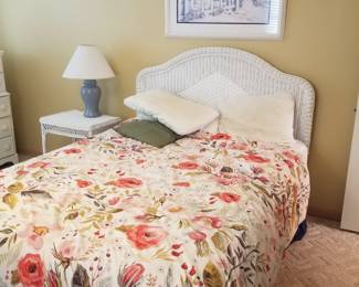 Queen bed; wicker end table