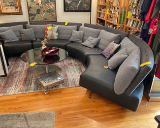 Curved leather and cloth sectional sofa $1500 + tax (depth=35” height of seat=14” height of back=30” length of each section=58”)