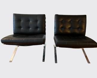Pair of black leather Barcelona chairs