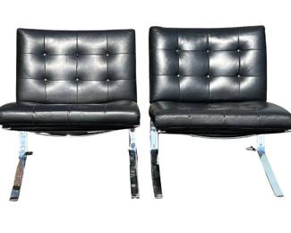 Pair of black leather Barcelona chairs