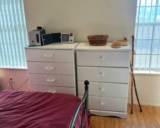 other angle of the dressers, some walking sticks and some rugs