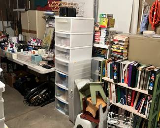 garage is packed with books, totes, wine rack & more