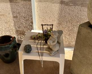 outdoor plastic table with some of the outdoor decor 