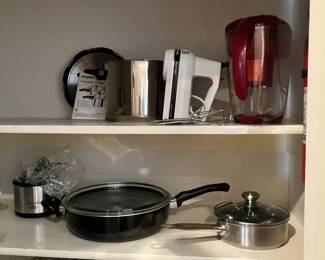 hand mixer, pots and pans, mini crockpot, popcorn set and some nut grinders