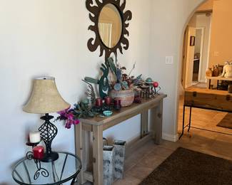 Beautiful Entry table with candle items on it and a vase with succulents (Not real) lamp, side table, more candle holders, Large Sun Mirror and 2 matching vases