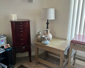 lamps, pottery, large jewelry box, some candles and one of the 3 matching end tables