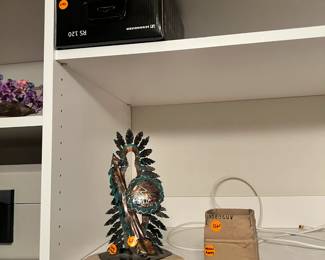 headphones, the Jay L Tschudy art piece and a box sculpture by Michael Harvey 