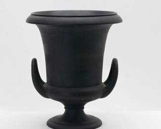 A fine circa 1880 Wedgwood Black Basalt campana vase, classical urn shape with twin handles in a matte finish. 6.75” tall. While Wedgwood often decorated their neoclassical arts era pieces with applied figures and decorations, here there is no decoration, relying on the shape, proportions, and the finest quality of black basalt to create a striking work of art.   