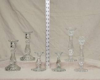 Stylish candlesticks including a pair of 1940s Fostoria Glass "Colony Swirl" candlesticks, a pair of Noritake crystal Hampton Hall candlesticks