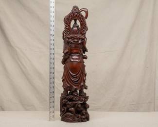 Another view of the stunning two-foot tall masterfully carved wooden Wei Tuo figure, right hand resting on a sword, a mandorla or halo of flames behind his head, and standing atop clouds and dragons.  Wei Tuo, also known as Skanda, is a Mahayana Bodhisattva regarded as a devoted guardian of Buddhist monasteries who guards the teachings of Buddhism.