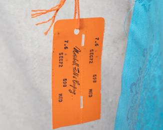 Closeup of new with tag NWT light blue Loungees Chinese style house coat, brocaded chrysanthemum pattern