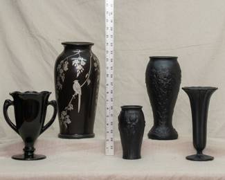 A vintage 1930s L.E. Smith black amethyst glass twin handled "trophy" vase, a Czechoslovakian Art Deco era black amethyst glass vase with painted silver decoration of bird on flowering branches, a 1930's Tiffin satin finish black amethyst glass iris vase, a Tiffin satin finish black amethyst glass poppies pattern vase, and a graceful black amethyst glass satin finish trumpet vase with fluted sides