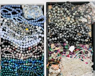 Lots and lots of beaded necklaces to choose from!Many are polished natural stone beads in a variety of colors and patterns.