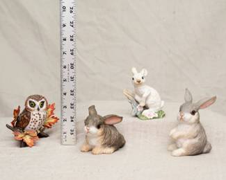 A Lenox porcelain Saw Whet Owl figurine, and three Boehm porcelain rabbit figurines: Rabbit at Rest, Snowshoe Hare, and Sitting Rabbit.