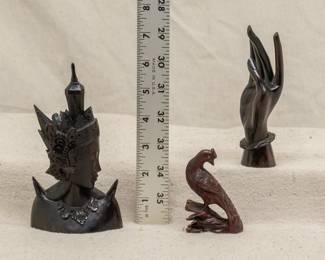 Vintage Indonesian carved wooden figures of a deity, a graceful open hand, and a bird