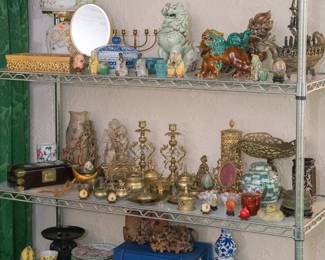 Lots of Chinese and Asian art at this estate sale - Chinese export porcelain, Chinese jade carvings, brass temple dogs, cinnabar vases, celadon glaze porcelain, sancai porcelain foo dogs, antique Chinese tea caddies in beautifully decorated lacquered boxes, Indonesian carved wooden figures, Chinese jade necklaces and earrings, and so much more to choose from!