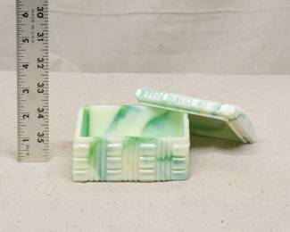 A vintage Akro Agate Company uranium glass slag glass lidded trinket or powder box
