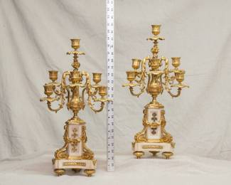 A magnificent pair of Louis XVI Style gilt bronze and marble seven-light candelabras