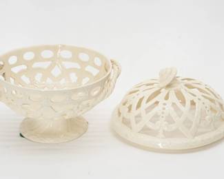 Another view of the A late 19th century antique Wedgwood cream ware footed “orange bowl” and cover, beautifully crafted with symmetrical pierced lattice work, garland and foliate scrolls with applied twisted rope handles and a flower finial. 10” high x 9” wide. Impressed Wedgwood stamp beneath the circular foot. 