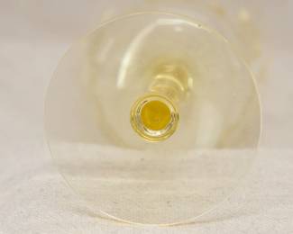 Closeup of the set of eight yellow depression glass goblets with etched floral design