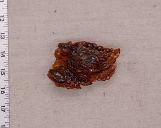 Another view of the carved amber piece in the form of a cicada resting on a cluster of grapes - a rich deep beautiful color!