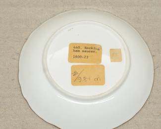 Another view of the early 19th century Rockingham porcelain dish hand painted with panels of floral sprays with moulded scrolls heightened with gilding