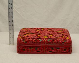 Another view of the large vintage Chinese cinnabar lacquerware lidded box, skillfully carved with peony flowers motif on a golden geometric ground, original maker's label to base.