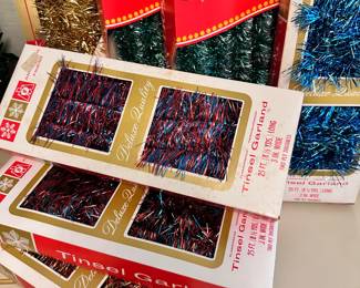 New in box vintage tinsel garland in a variety of sparkly colors