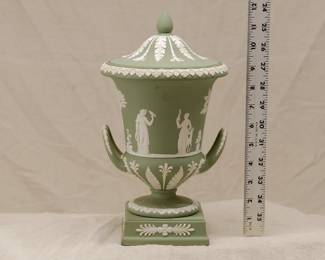Vintage Wedgwood green jasper ware double handled covered urn on plinth, decorated with cream color sprig depicting Classical figures