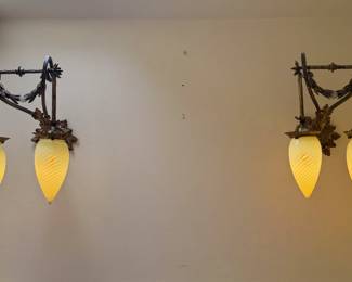 A pair of gorgeous antique sconces with four matching antique hand blown teardrop shape opalescent swirl Vaseline glass (that is also uranium glass) shades