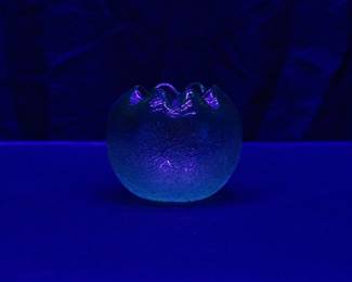 Seen under blacklight: Antique hand blown cranberry uranium glass rose bowl