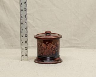 A rare late 19th century Wedgwood Vigornian ware (treacleware) Rockingham lidded tobacco jar with acid etched floral decoration
