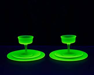Seen under black light: Vintage depression era frosted canary yellow uranium glass dessert sets, a sherbet glass, liner, and luncheon plate.