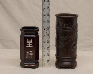 Another view of the two carved Chinese brush pots, one with inlaid mother of pearl in a bamboo and plum blossom motif, one carved with a phoenix bird flying amongst clouds