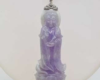 Closeup of the carved lavender jade Guanyin pendant mounted in 18k white gold with diamonds