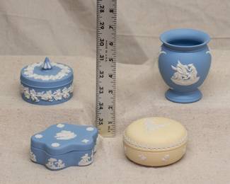 Wedgwood jasperware lidded trinket boxes in blue and in primrose yellow, with a Wedgwood jasperware urn shape vase