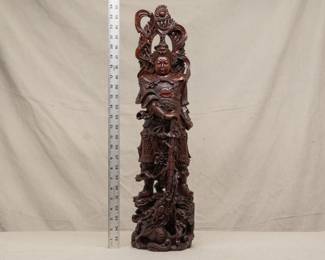 A stunning two-foot tall masterfully carved wooden Wei Tuo figure, right hand resting on a sword, a mandorla or halo of flames behind his head, and standing atop clouds and dragons.  Wei Tuo, also known as Skanda, is a Mahayana Bodhisattva regarded as a devoted guardian of Buddhist monasteries who guards the teachings of Buddhism.