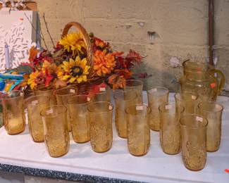 Vintage amber glass pitcher with ice lip and 16 matching pattern amber glass tumblers