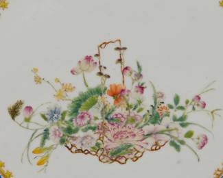 Closeup of a pair of vintage Chinese export porcelain plaques skillfully hand painted in Famille Rose enamels. Central design of baskets of flowers inside a blue enamel scrolling foliage band edged with a yellow spearhead border. Very fine shading and depiction of the flowers including morning glory, chrysanthemum, peony, lotus, and roses. Unsigned on the front, sealed in wood frames.