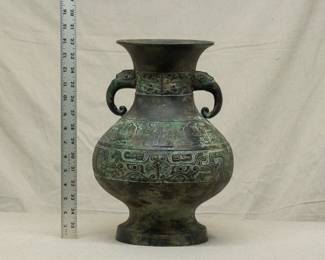 A very large Chinese archaistic bronze or patinated brass vase, flanked with pair elephant head handles at the neck
