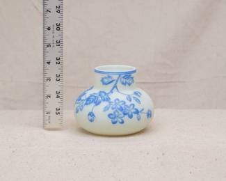 Antique Harrach or Thomas Webb & Sons cameo glass vase circa 1890, cased blue over creamy white uranium glass, cameo cut around the body with flowering petals on leafy vines. A banded blue rim at the top and a polished pontil on the base.