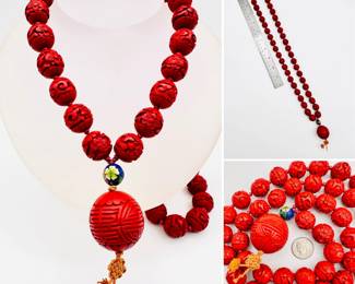 Brilliant Chinese necklace of carved cinnabar beads, with a cloisonné bead suspending a larger cinnabar bead and Chinese knot tassel pendant