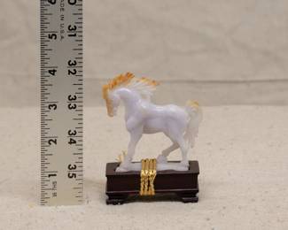 A Chinese lavender jade carved figure of a horse with wooden stand