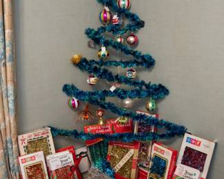 Vintage Christmas decorations including table top trees, tinsel garlands, hand blown glass ornaments, and LOTS more holiday decorations...